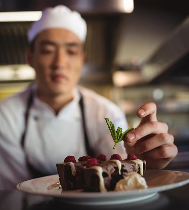 Chef with menu dish